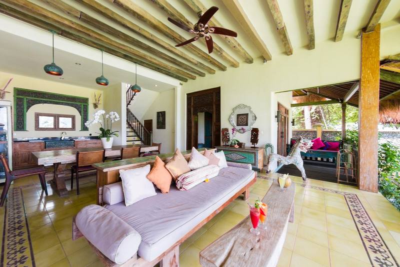 Bright living room of the Perfumed Garden with daybed and antique furniture