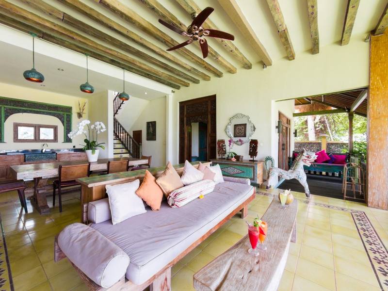 Bright living room of the Perfumed Garden with daybed and antique furniture