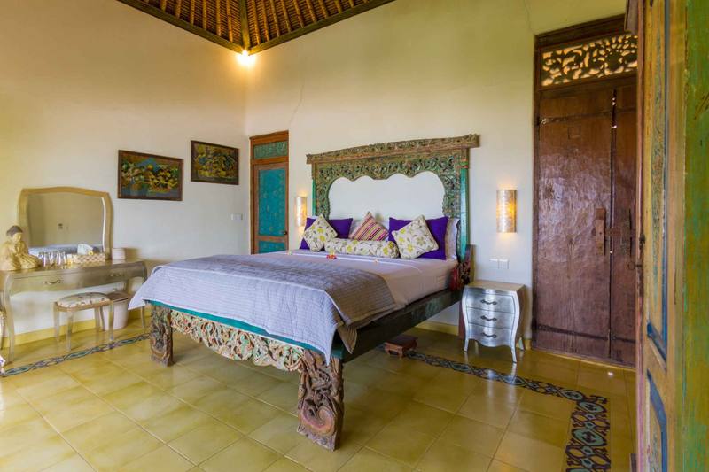 The Passion Flower Suite with antique carved king-size bed