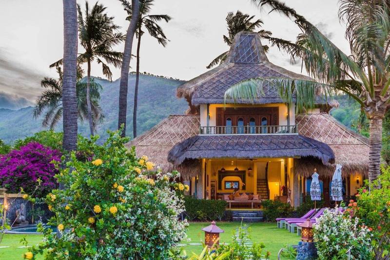 The Perfumed Garden beach house with its thatched joglo roof and bougainvillea