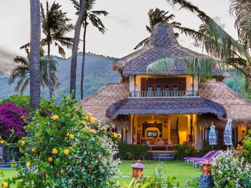 The Perfumed Garden beach house with its thatched joglo roof and bougainvillea