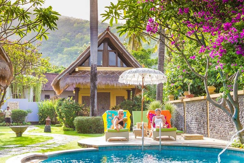 Sun loungers beside the pool in the tropical garden of Life in Amed