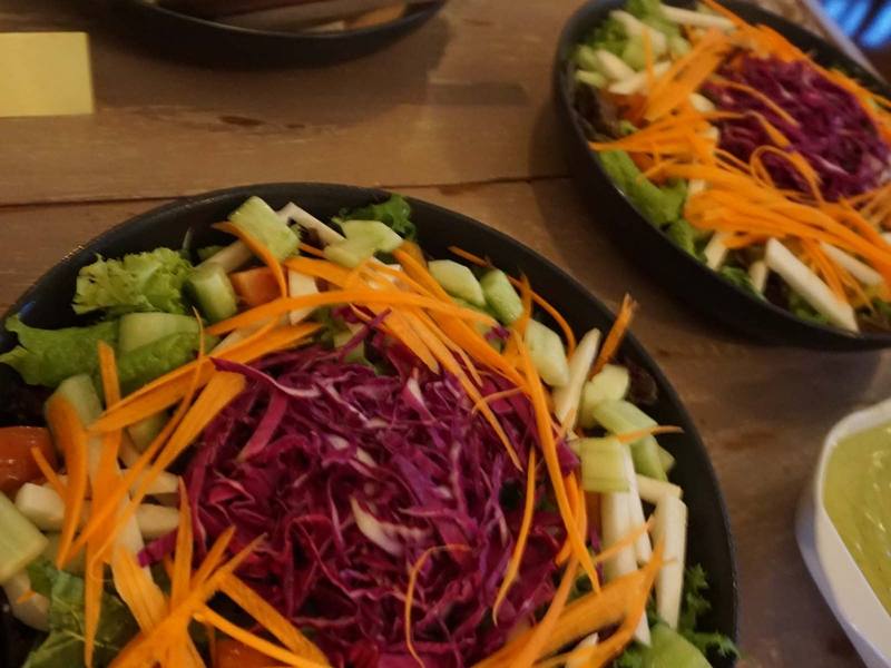 A vegan salad with shredded carrot and red cabbage