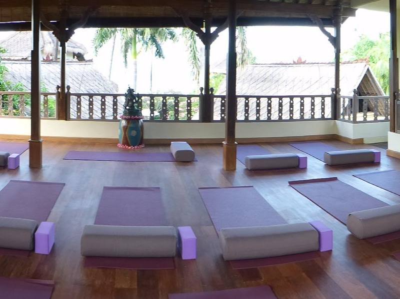 Panorama of the yoga shala with mats, bolsters and blocks laid out